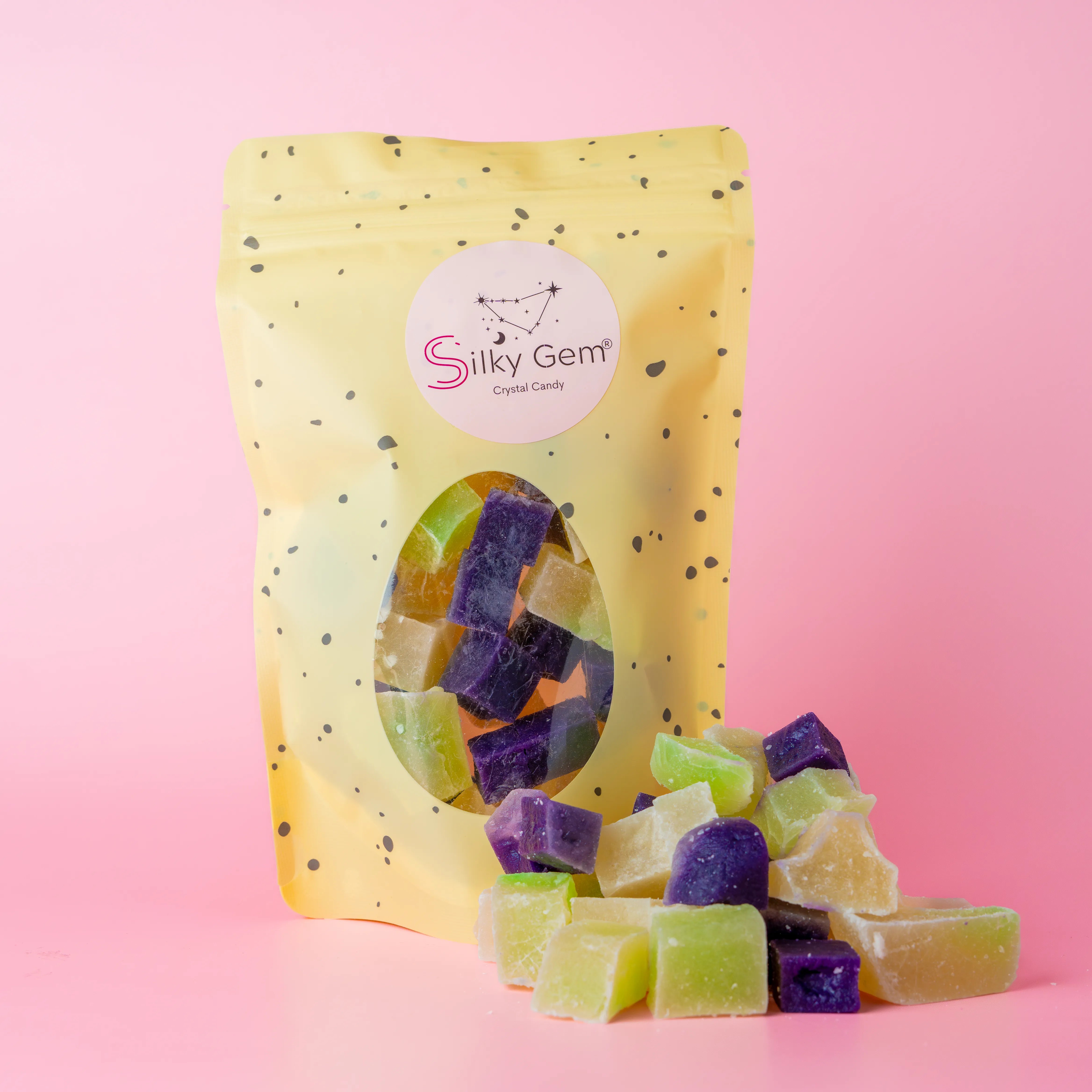 Coconut snack bites pouch with purple, white, and green crystal candy.