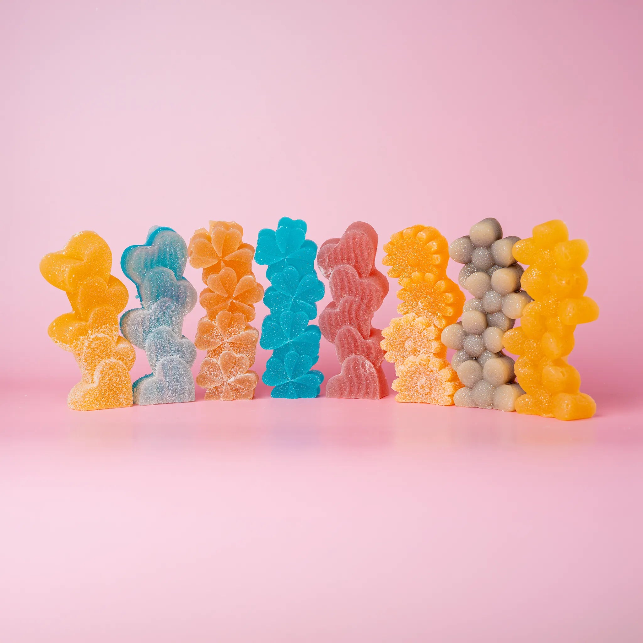 8 candies, assorted colors, dusted with sour sugar.