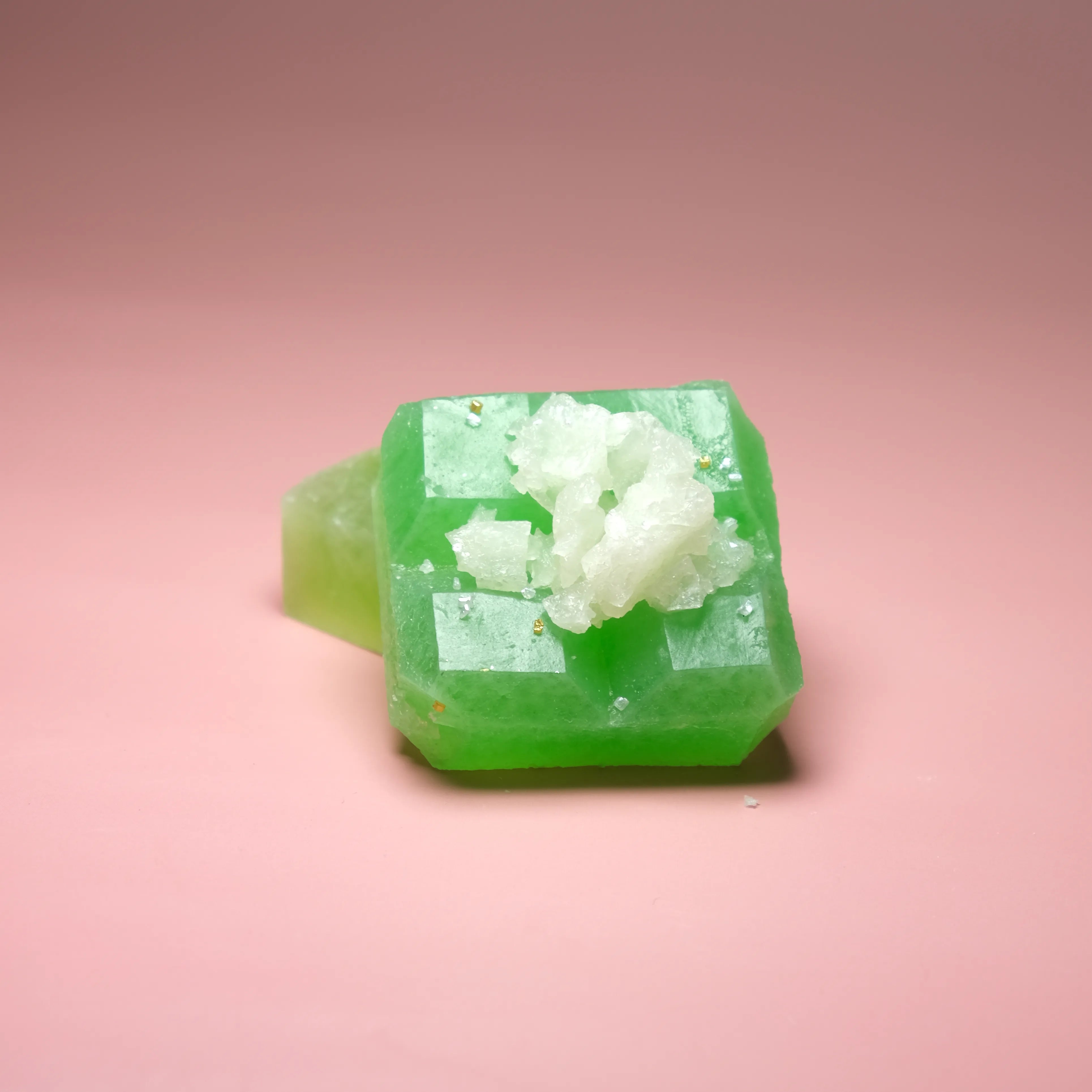 Green apple and pear flavored Silky Gem crystal candy with a bright green translucent cube and white crystal topping.