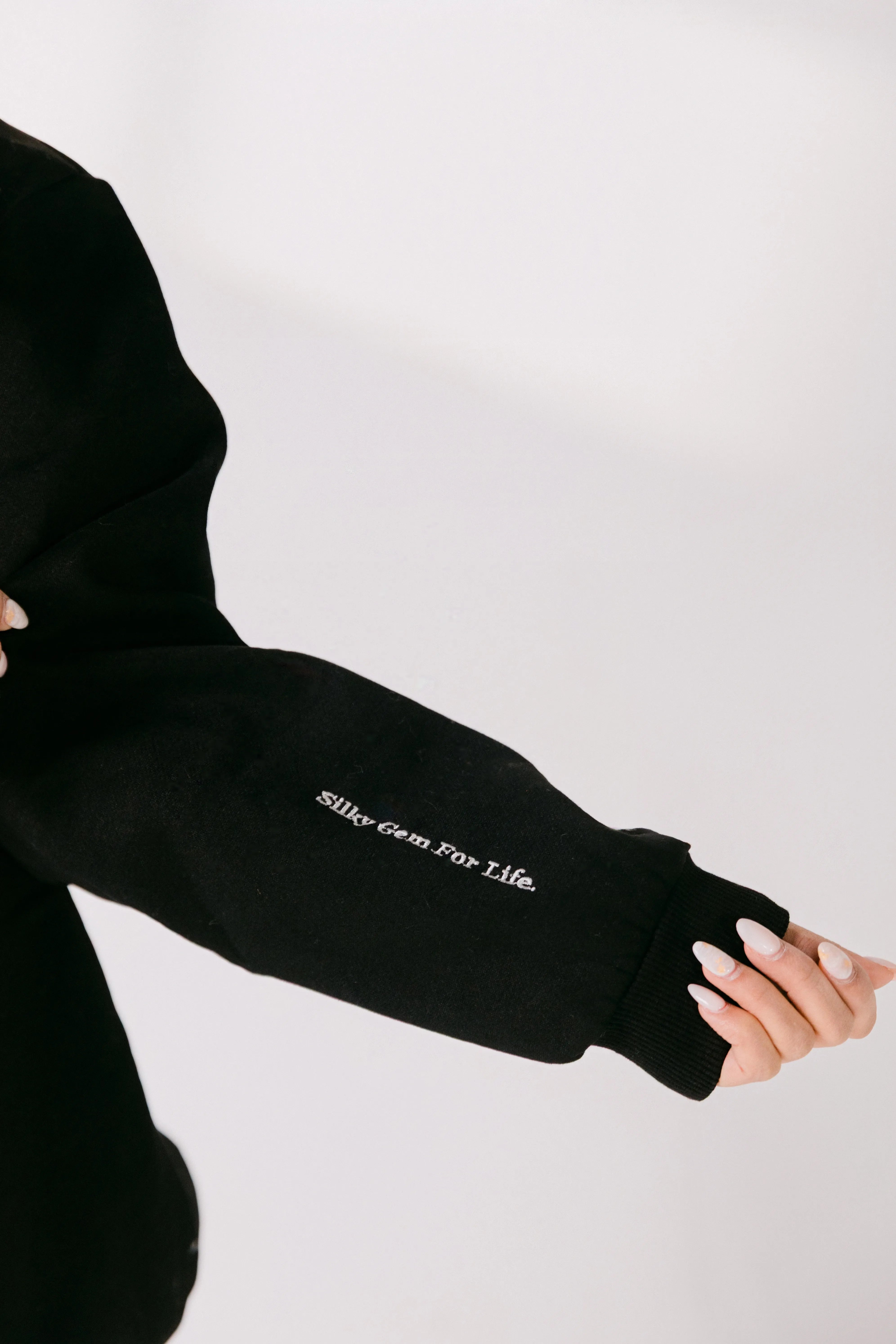 Close-up of sleeve detail reading “Silky Gem For Life.”