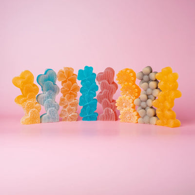 8 candies, assorted colors, dusted with sour sugar.