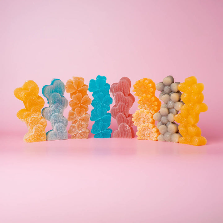 8 candies, assorted colors, dusted with sour sugar.