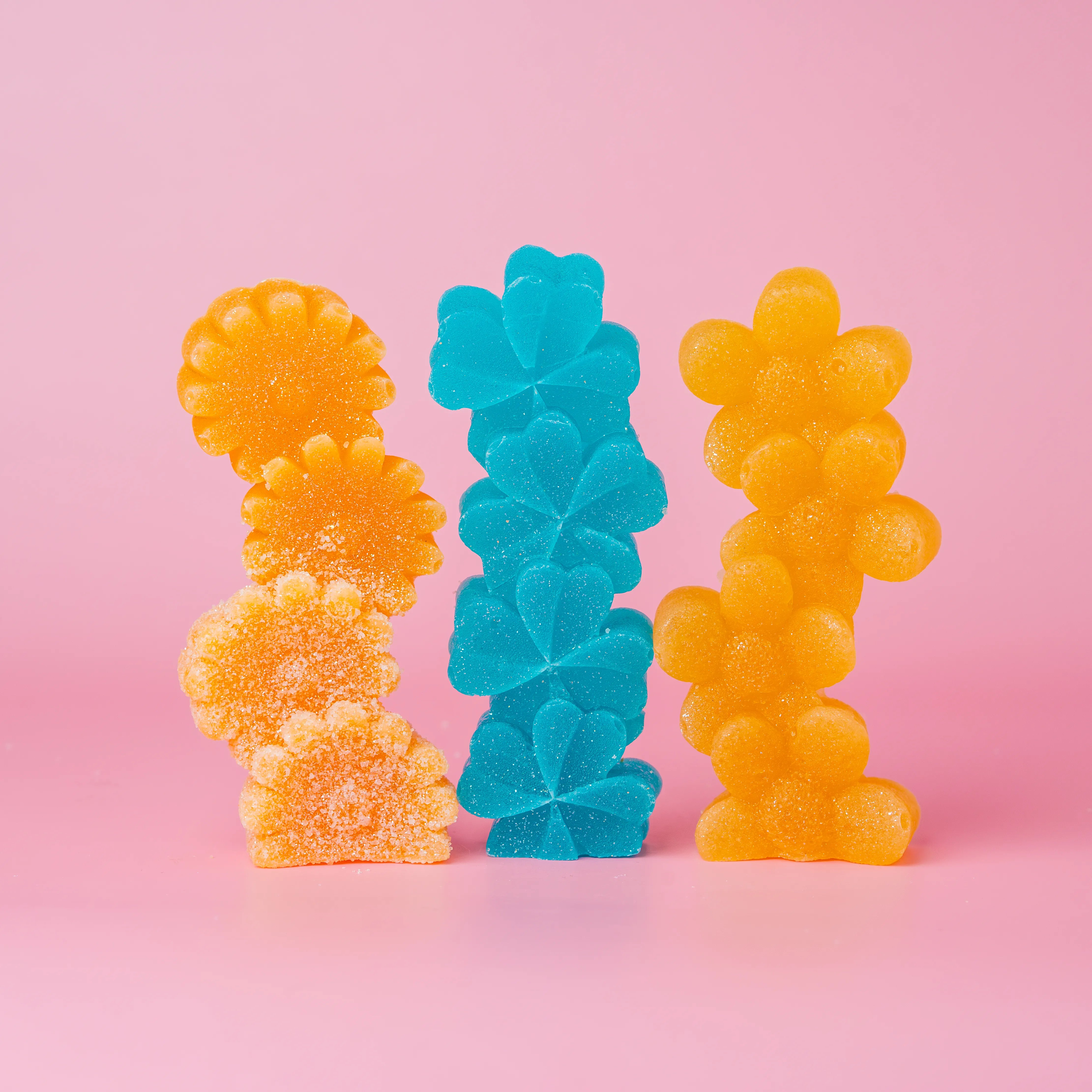 Trio of candies. Orange, blue, and yellow. 