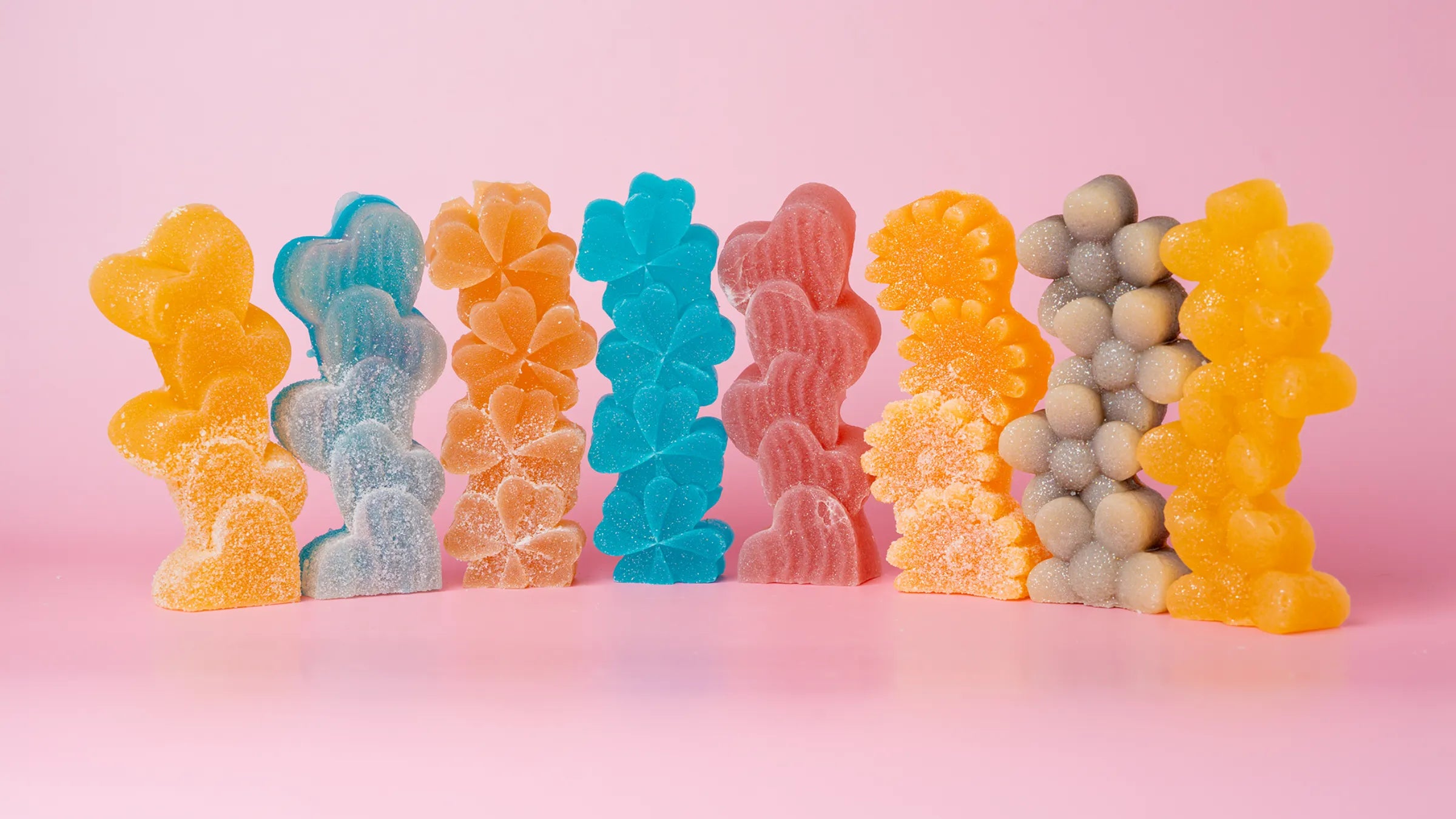 8 candies, assorted colors, dusted with sour sugar.