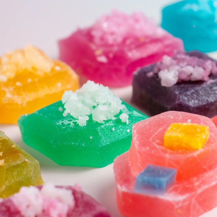 A variety of colorful Silky Gem candies displayed, showcasing different flavors such as guava, grape, vanilla, and others.