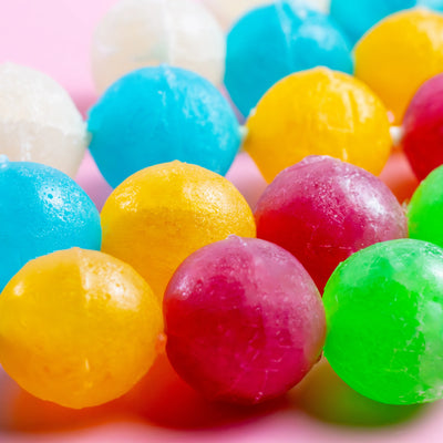 Close-up of colorful crystal candy pieces on a Silky Gem Crystal Pop