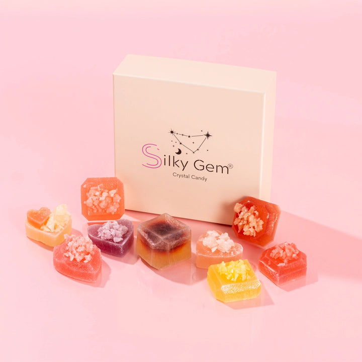 Silky Gem crystal candy set with a branded box on a pink background