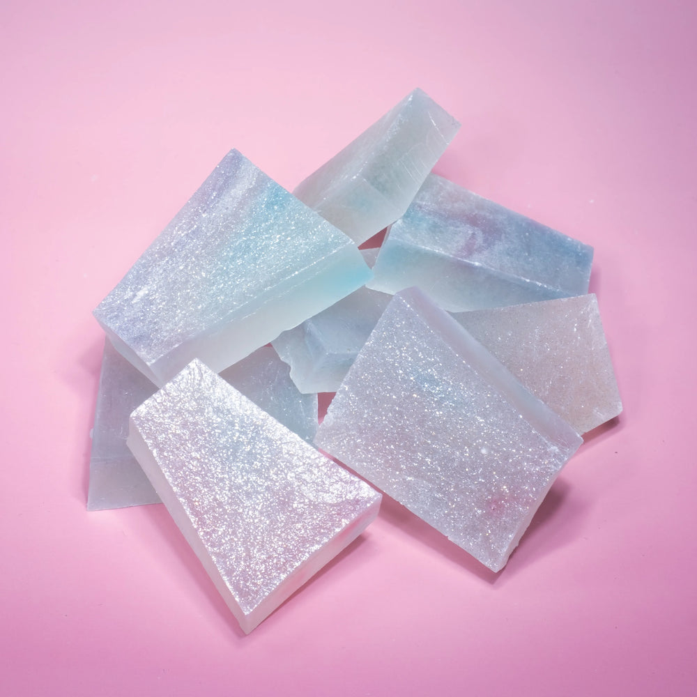 A pile of lychee aurora crystal candy with blue and purple  hue, almost translucent.