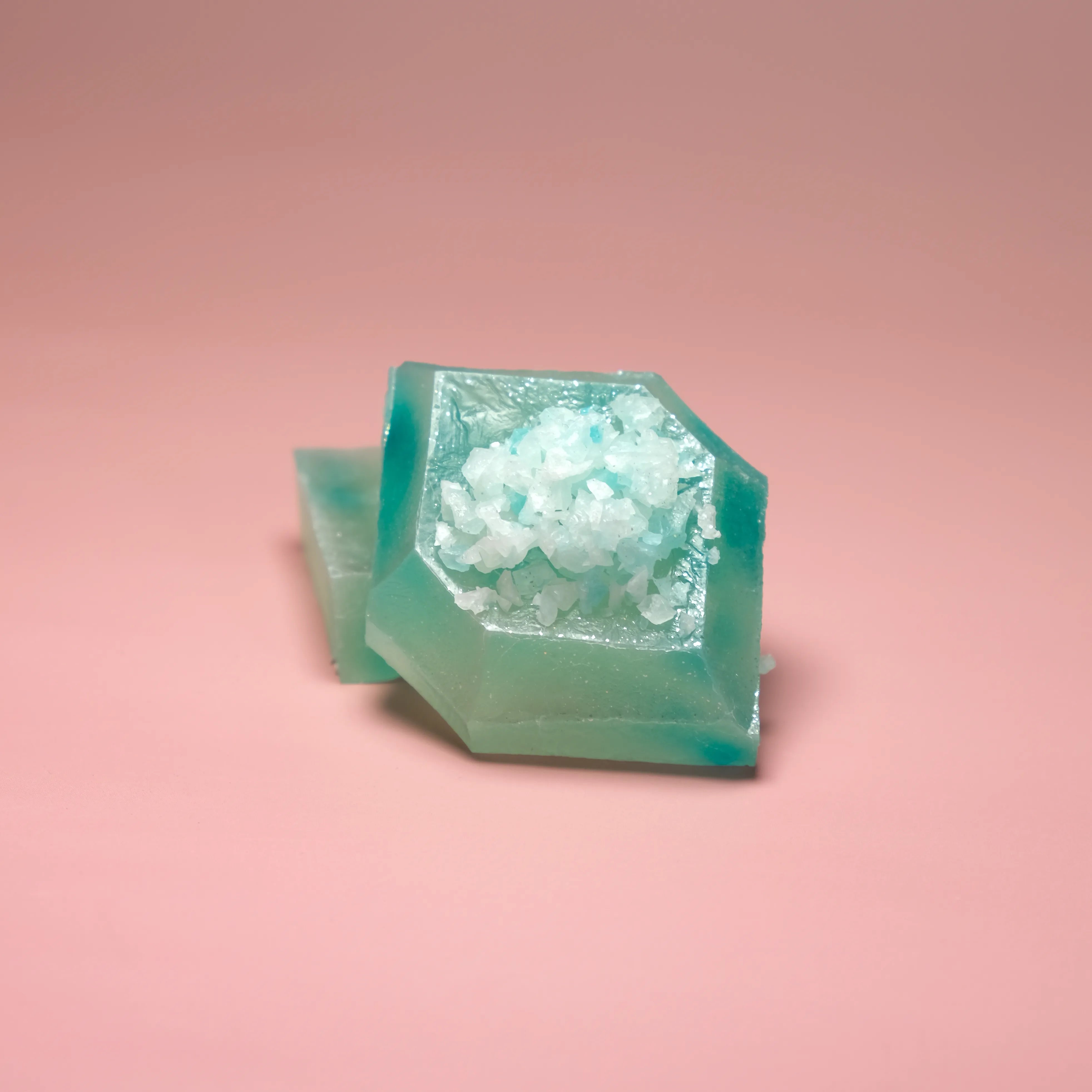 Lychee Aurora flavored Silky Gem crystal candy with a soft aqua translucent cube and icy white crystal topping.