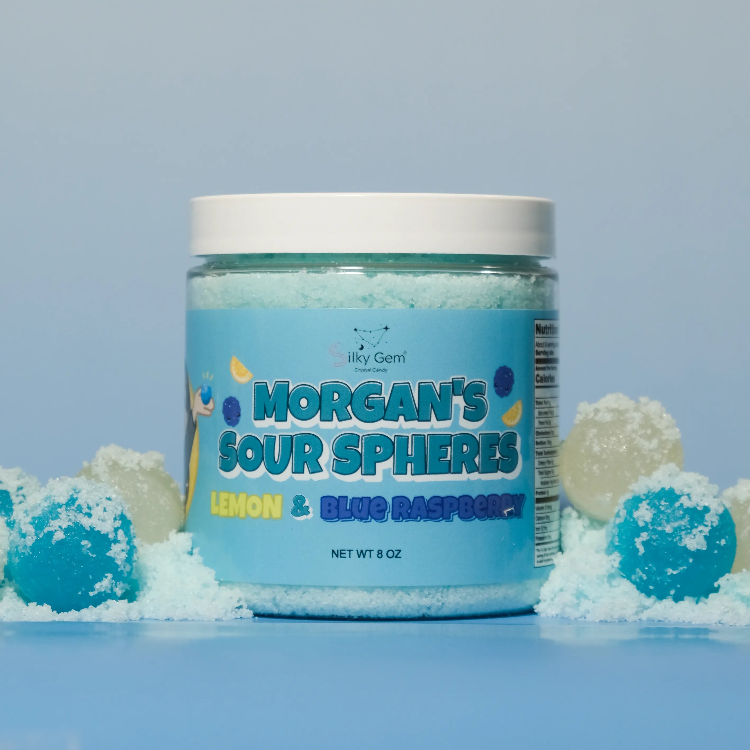 Jar of Morgan's Sour Spheres on a blue background