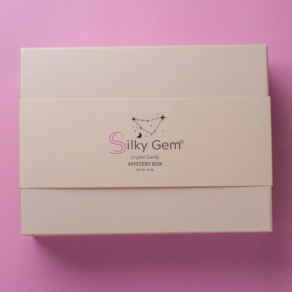 Silky Gem Mystery Box packaging on a pink background