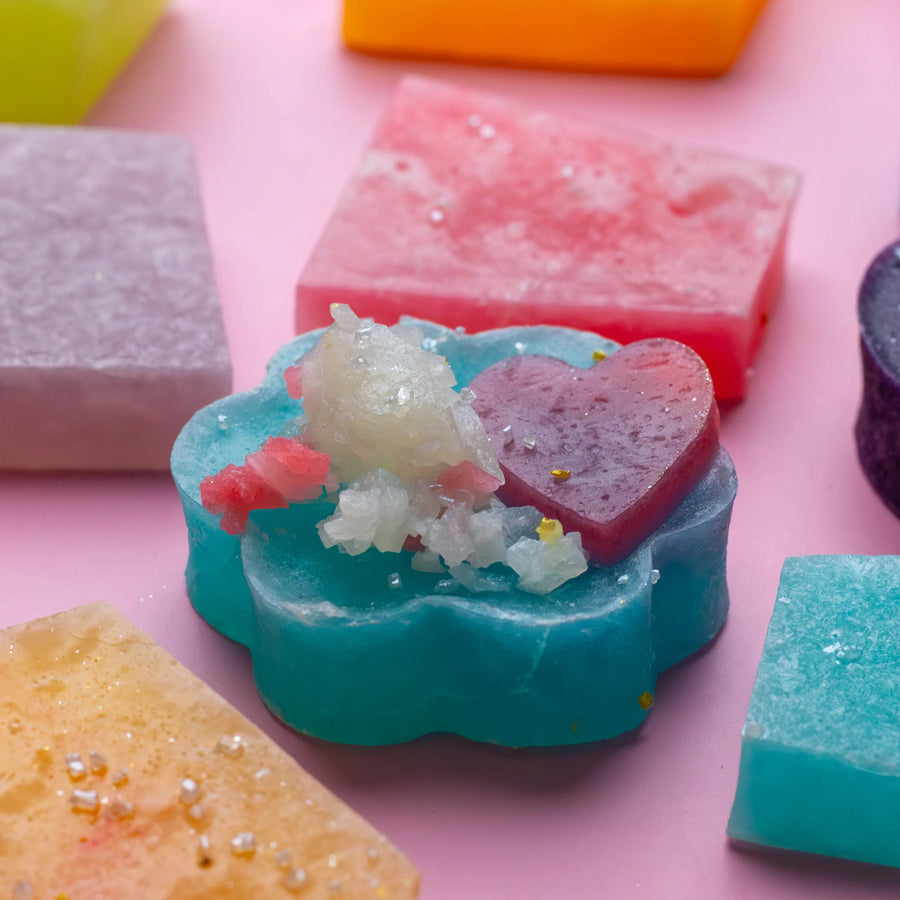 Hand holding colorful Silky Gem crystal candies