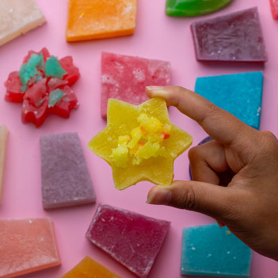 Hand holding a star-shaped Silky Gem crystal candy from the Mystery Box