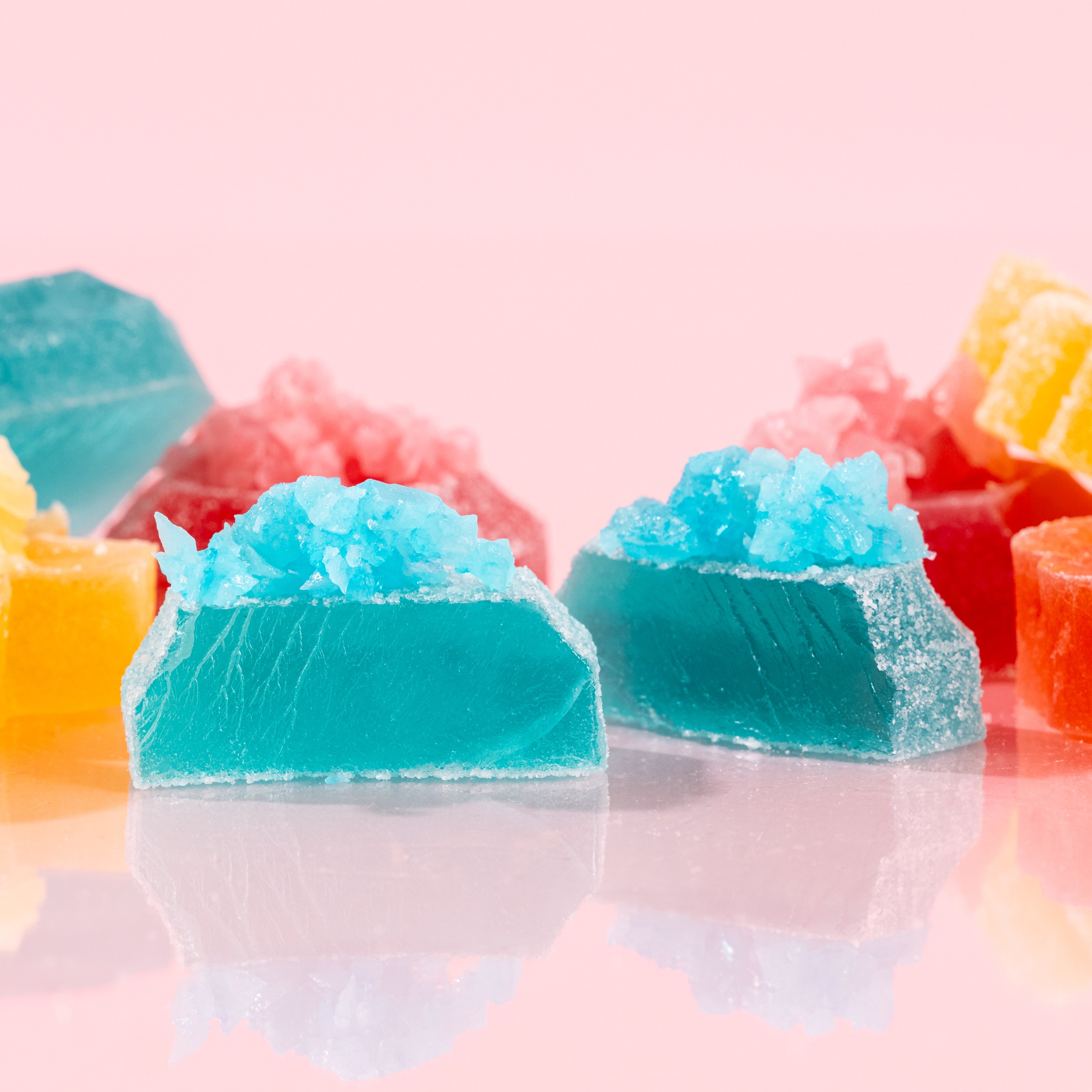 Close-up of cut-open Silky Gem crystal candy pieces from The Golden Lava collection. 