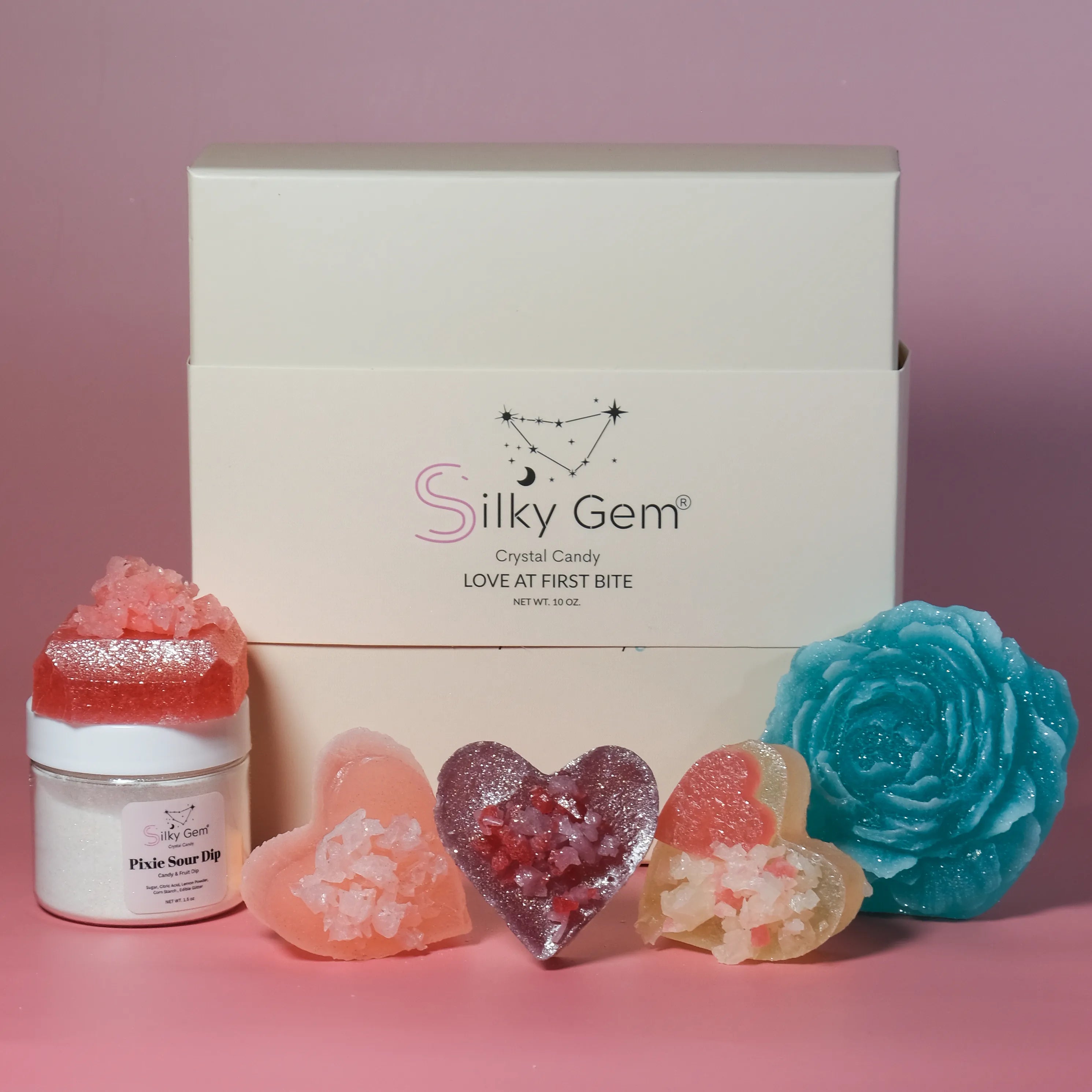 Silky Gem crystal candy set with a box on a pink background