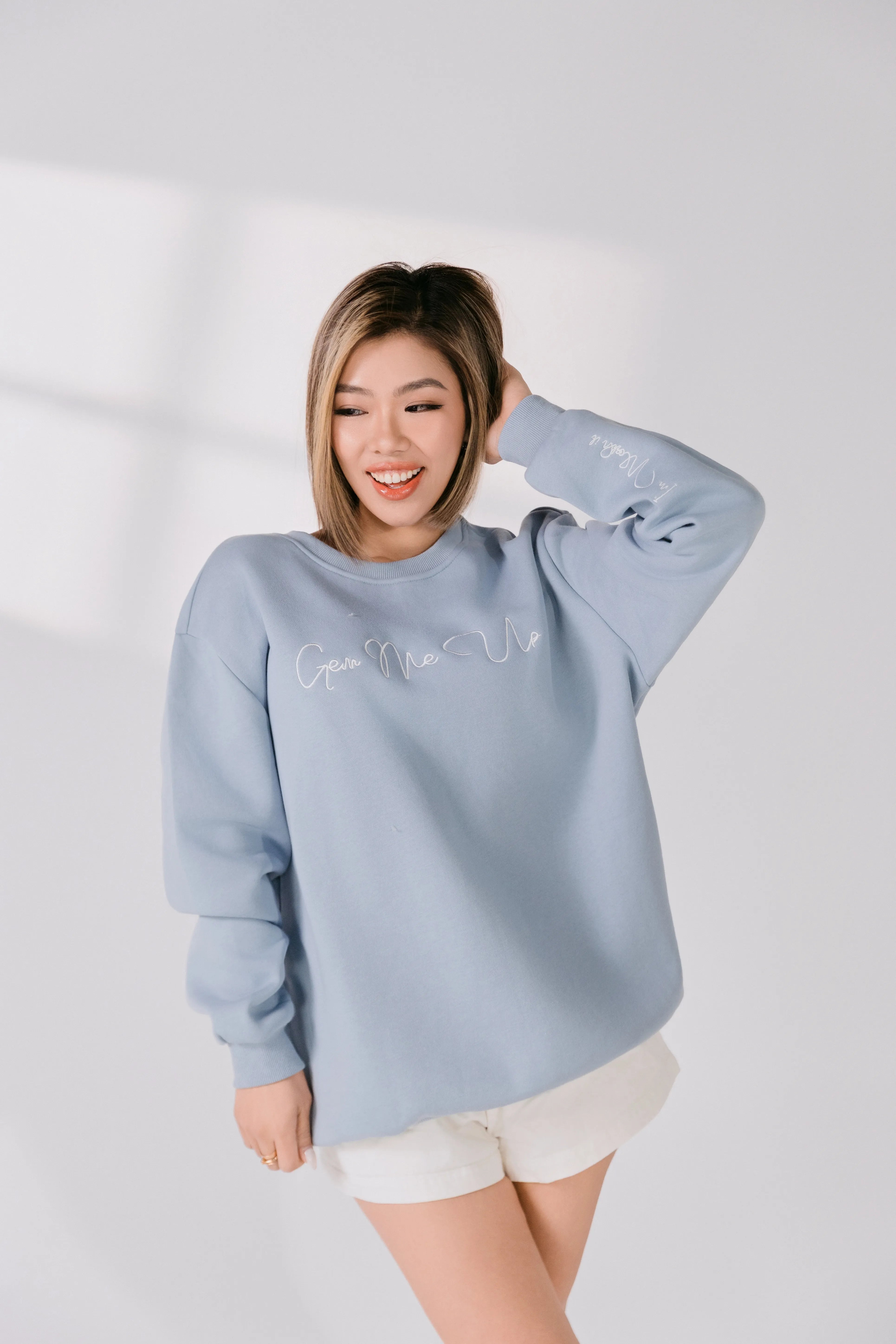 Front view of relaxed fit powder blue crewneck sweatshirt.