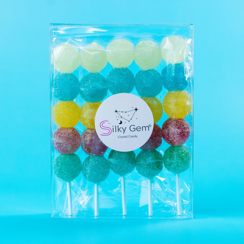 Colorful Sizzle Pop skewers coated in sparkling sour Sizzle Glitter