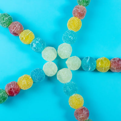 Five Silky Gem Sizzle Pop skewers with sour crystal candy pieces